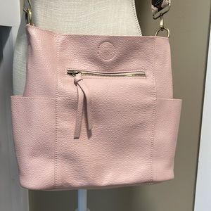 Baby pink leather crossbody bag.